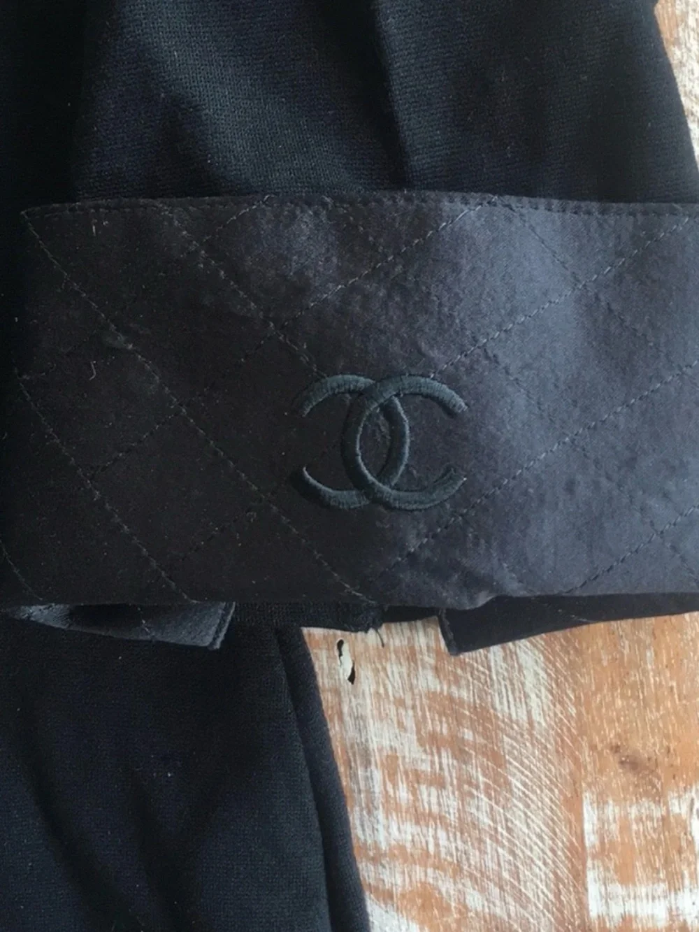 CHANEL black quilted boatneck employee uniform top